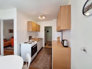a kitchen with a white stove top oven in a room at Apartman Pasic in Sarajevo