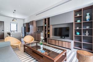 Μια τηλεόραση ή/και κέντρο ψυχαγωγίας στο 2 BR Condo at Cabo Marina Private Jacuzzi & Grill