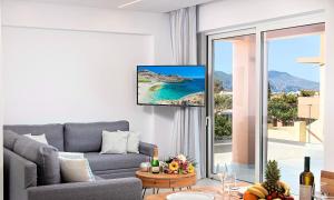 a living room with a couch and a view of the ocean at Ferienhaus Für 12 Personen In Chania, Kreta West Kreta in Dhrámia +21 photos