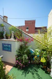 a garden with flowers and plants on a balcony at La Bella Annacapri in Anacapri