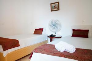 Postel nebo postele na pokoji v ubytování Hotel dos Lagos