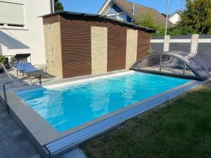 a swimming pool with a cover over it at Time4you am Bodensee mit Pool Sauna Kamin in Radolfzell am Bodensee