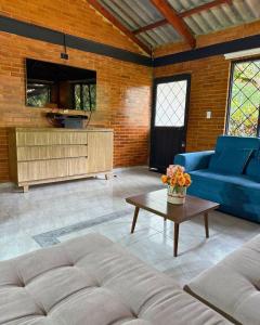 a living room with a couch and a table at Eco Boutique House in La Vega