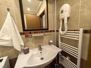 a bathroom with a sink and a mirror at Stela Apartment in Santa Marina Holiday in Sozopol