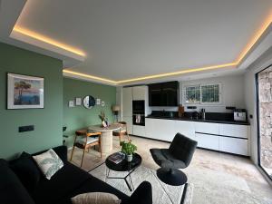 a living room with a couch and a table at Maison C in Nice