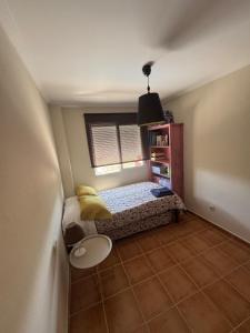 a small bedroom with a bed and a window at La Casa del Olivo en Montserrat - Valencia in Valencia +28 photos