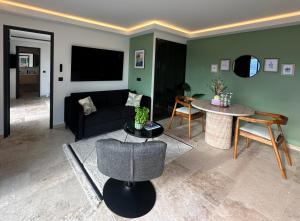 a living room with a couch and a table at Maison C in Nice