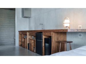a kitchen with a counter with a sink and a counter at Tanegashima Araki Hotel Bekkan - Vacation STAY 57000v in Nishinoomote