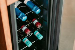 a refrigerator filled with bottles of wine at Tanegashima Araki Hotel Bekkan - Vacation STAY 57000v in Nishinoomote