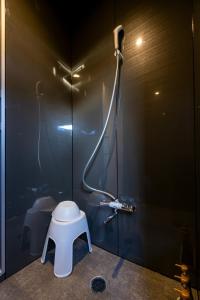 a bathroom with a shower with a toilet in it at Itoshima Resort TUMUGU - Vacation STAY 18263 in Fukuoka
