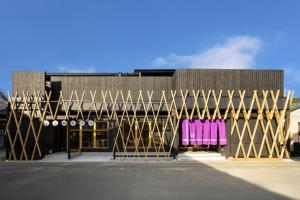 a building with two pink chairs in front of it at Itoshima Resort TUMUGU - Vacation STAY 18230 in Fukuoka