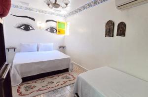 Postel nebo postele na pokoji v ubytování Riad Safir Fes Deluxe
