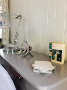 a toy lizard on a table in a bedroom at Lakeside Cabin on Stilts- 'Kingfisher' in Rous Lench