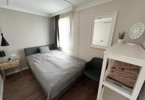 Postel nebo postele na pokoji v ubytování Aranypart Apartmanházak Tiszakécske
