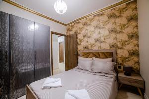 Ένα ή περισσότερα κρεβάτια σε δωμάτιο στο Charming and quiet apartment 2 +2 φωτογραφίες