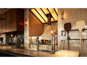 a kitchen with a pizza oven in a building at THE KNOT HIROSHIMA - Vacation STAY 32482v in Hiroshima