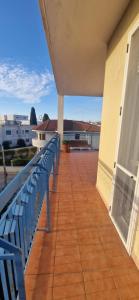 a balcony with a blue bench on a building at Cristal Appartament in Brindisi