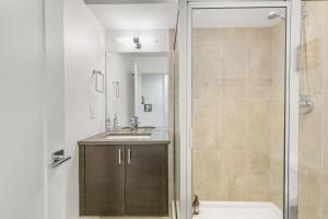 a bathroom with a shower and a sink at Needle Nest 22 in Seattle +39 photos