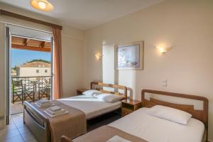 Ένα ή περισσότερα κρεβάτια σε δωμάτιο στο Sorelle Studios