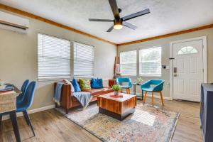 a living room with a couch and chairs and a ceiling fan at 5 Mi to Dtwn Tulsa Pet-Friendly Home! in Tulsa