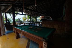 a pool table sitting inside of a bar with at Casa da Ilha & SPA in Abraão