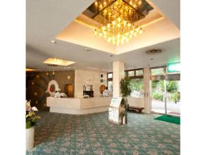 a lobby with a chandelier and a waiting room at Dogashima Onsen Hotel - Vacation STAY 55277v in Tago