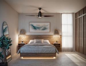 a bedroom with a bed and two tables with lamps at Aytana Luxury Living in Chuburná