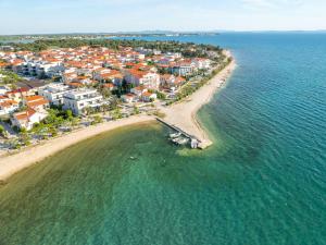 an aerial view of a beach with houses and the ocean at Apartments Dernaj in Vir