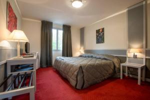 Postel nebo postele na pokoji v ubytování Hostellerie St Vincent