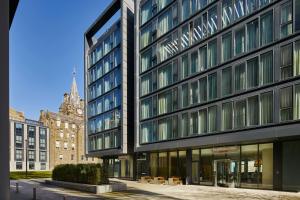 a tall black building on a city street at Residence Inn by Marriott Edinburgh in Edinburgh