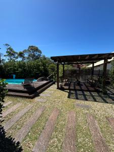 Swimmingpoolen hos eller tæt på RESIDENCIAL MARÉ ALTA-CABANA 1-PRAIA DO ROSA/SC
