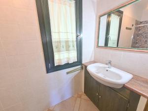 a bathroom with a sink and a window at Sa Domixedda in Villasimius +41 photos