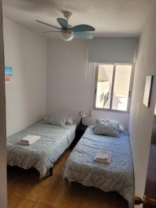 En eller flere senge i et værelse på Apartamento Montserrat