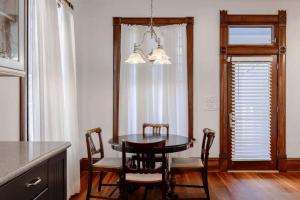 a dining room with a table and chairs and a window at Charming 5 Bedroom Home in Austin in Austin +24 photos