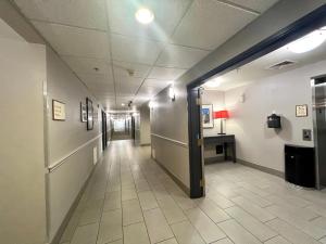 an empty hallway in a hospital with a hallway at Country Inn & Suites by Radisson, Fort Worth, TX in Fort Worth +47 photos