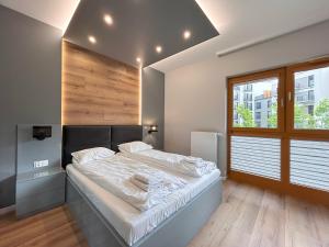 Posteľ alebo postele v izbe v ubytovaní ApartmentPrestige Central Station