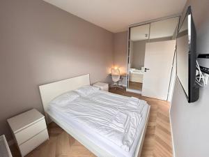 Posteľ alebo postele v izbe v ubytovaní ApartmentPrestige Central Station