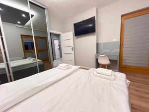 Posteľ alebo postele v izbe v ubytovaní ApartmentPrestige Central Station