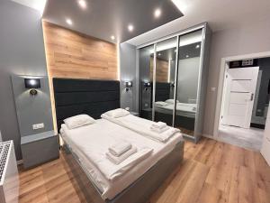 Posteľ alebo postele v izbe v ubytovaní ApartmentPrestige Central Station