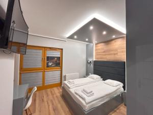 Posteľ alebo postele v izbe v ubytovaní ApartmentPrestige Central Station