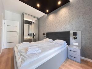Posteľ alebo postele v izbe v ubytovaní ApartmentPrestige Central Station