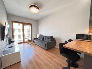 Televízia a/alebo spoločenská miestnosť v ubytovaní ApartmentPrestige Central Station