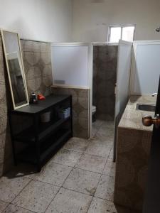a bathroom with a sink and a mirror at 888 Casa Cabal Budget Rental 888 in Cancún +31 photos
