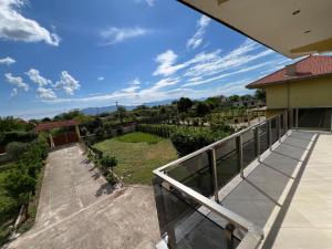 a balcony with a view of a yard at Villa SM Shkodër in Shkodër +47 photos