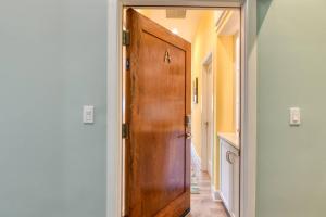 a wooden door with the letter a on it in a hallway at 61 Spanish St. Unit A in St. Augustine +42 photos