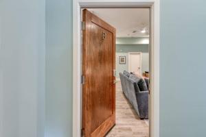 a door leading into a living room with a couch at 61 Spanish St. Unit B in St. Augustine
