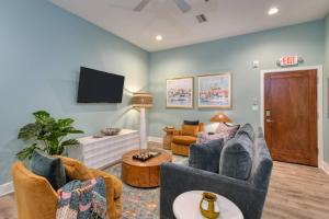 a living room with a couch and a tv at 61 Spanish St. Unit B in St. Augustine +41 photos
