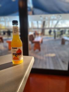 a bottle of beer sitting on top of a table at 287 Cafe & Motel in Wairoa