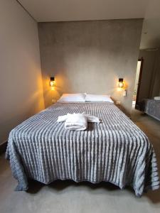 Una cama o camas en una habitación de Taguato
