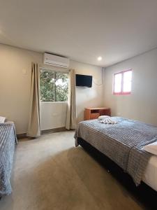 Una cama o camas en una habitación de Taguato